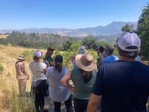 Teachers listening to Clint McCay while looking at St. Helena